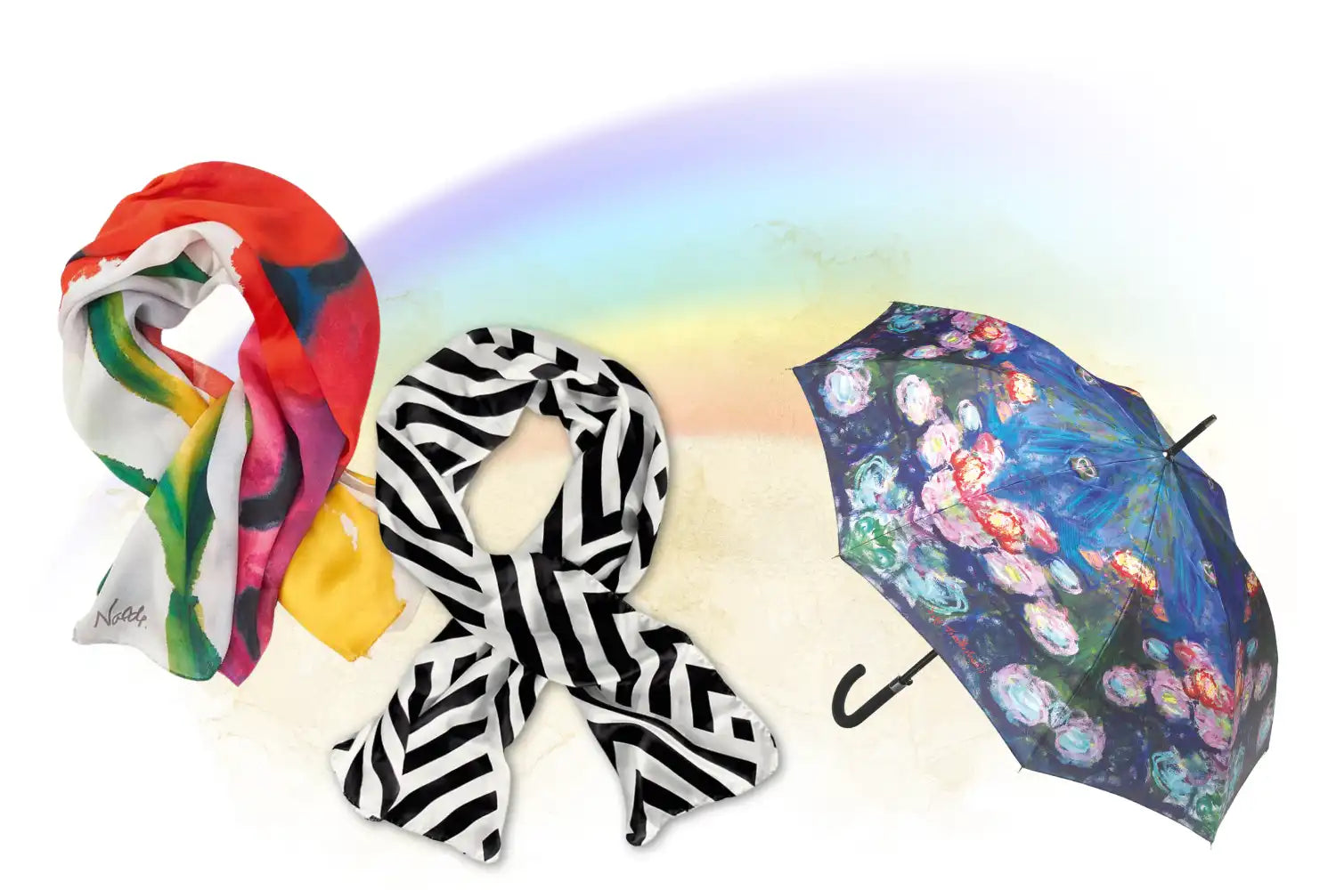 Ein bunter Schal, ein schwarz-weiß gestreifter Schal und ein geblümter Regenschirm unter einem schwachen Regenbogen.