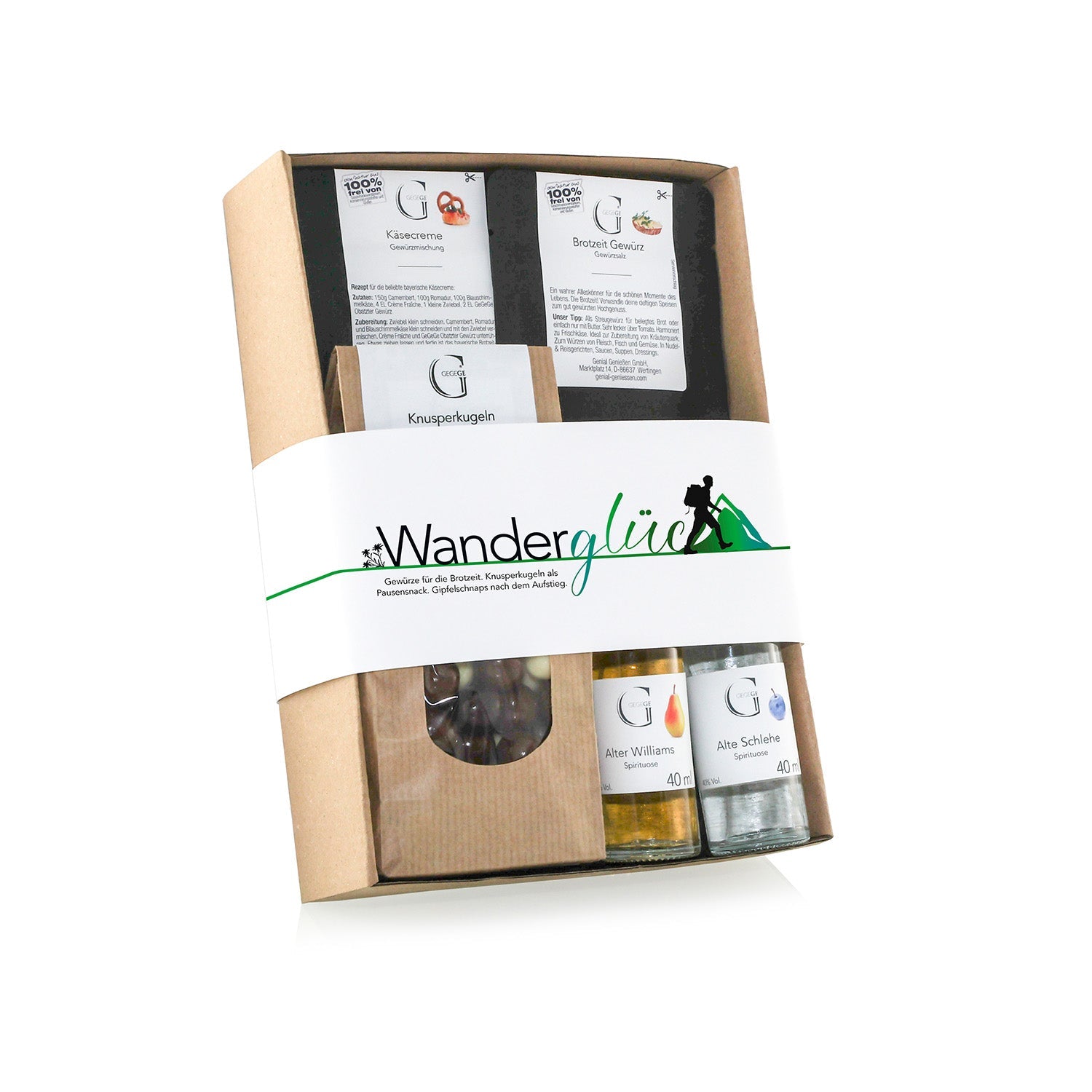 Das Hobby-Set Wanderglück ist ein Geschenkset zum Thema Bergwandern mit Knusperriegeln, Pralinen und Obstbrandfläschchen. Die Verpackung präsentiert Knusperkugeln mit dem Wanderglück-Etikett und einer Wanderer-Silhouette.