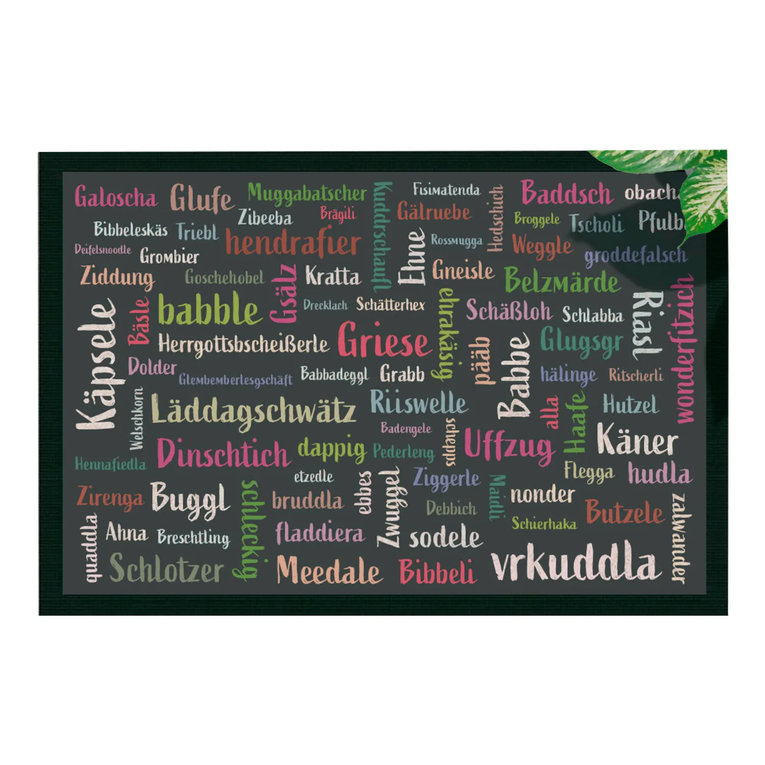 Mundart-Fußmatte mit bunten Dialekt-Begriffen auf dunklem Hintergrund