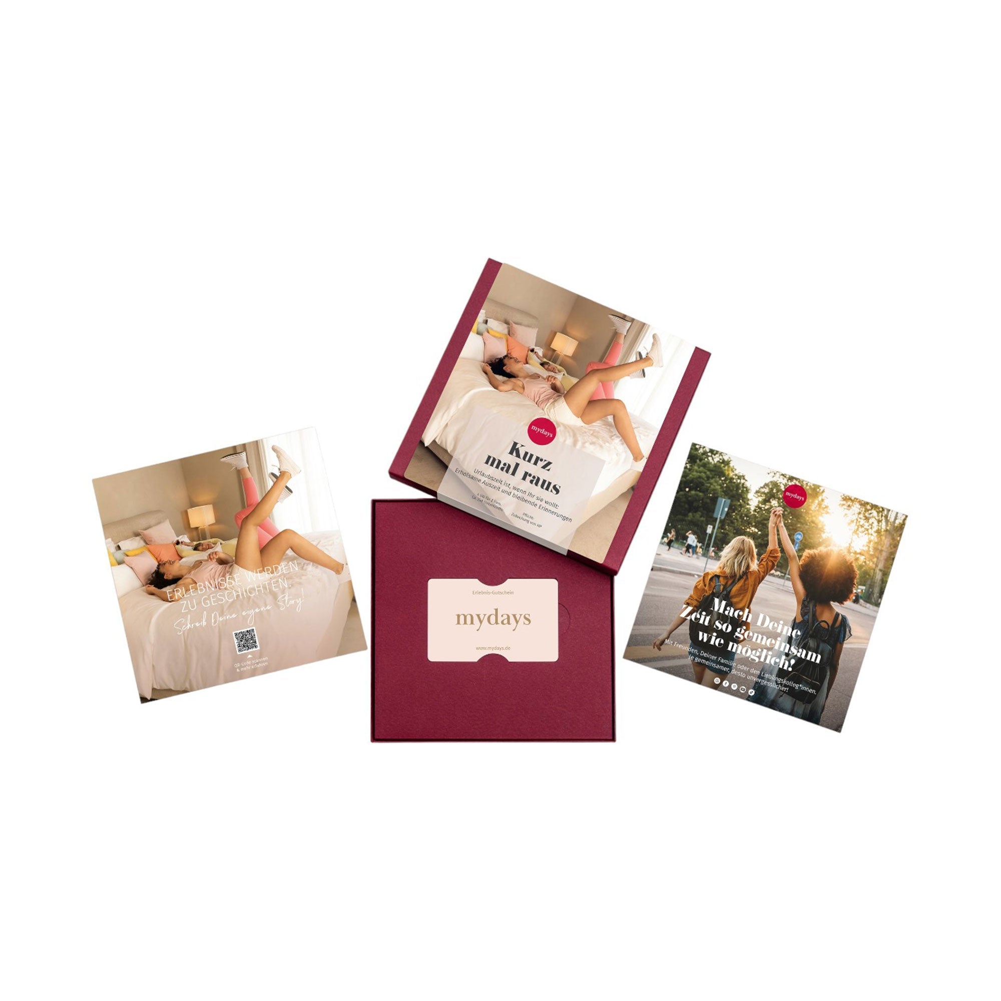 Die kastanienbraune „mydays Geschenkbox“ mit der Aufschrift „Erlebnis-Box Kurz mal raus“ enthält drei Broschüren. Zwei davon zeigen Menschen, die mit hochgelegten Beinen auf Betten liegen und so eine fröhliche, entspannte Atmosphäre schaffen – ideal für einen Kurz mal raus-Ausflug oder ein wunderbares Kurzurlaub-Erlebnis in Europa.