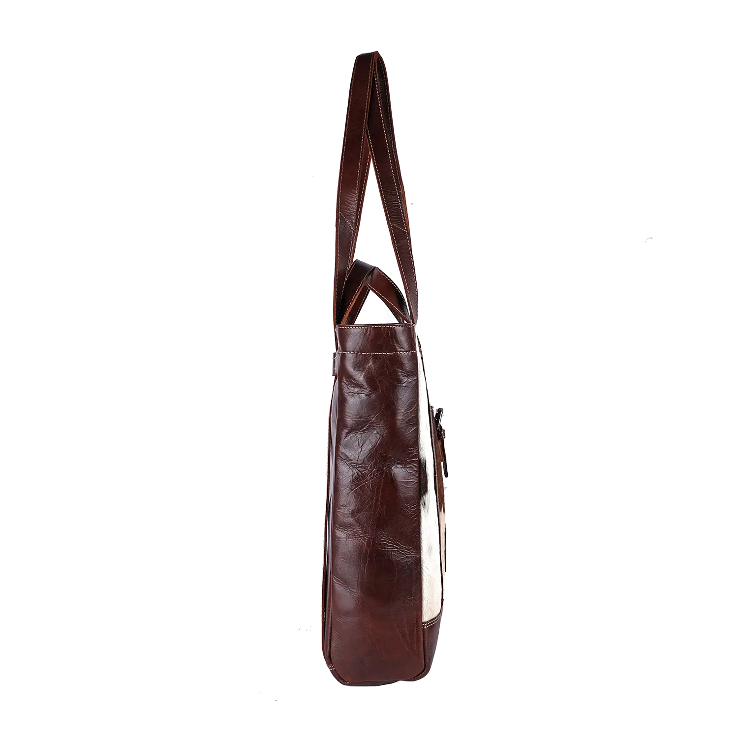 Seitenansicht der braunen Leder-Shopper-Handtasche HALLODRI mit zwei Henkeln. Die glatte Textur und das strukturierte Design spiegeln einzigartige Handwerkskunst wider und verbinden mühelos Stil mit Funktionalität.