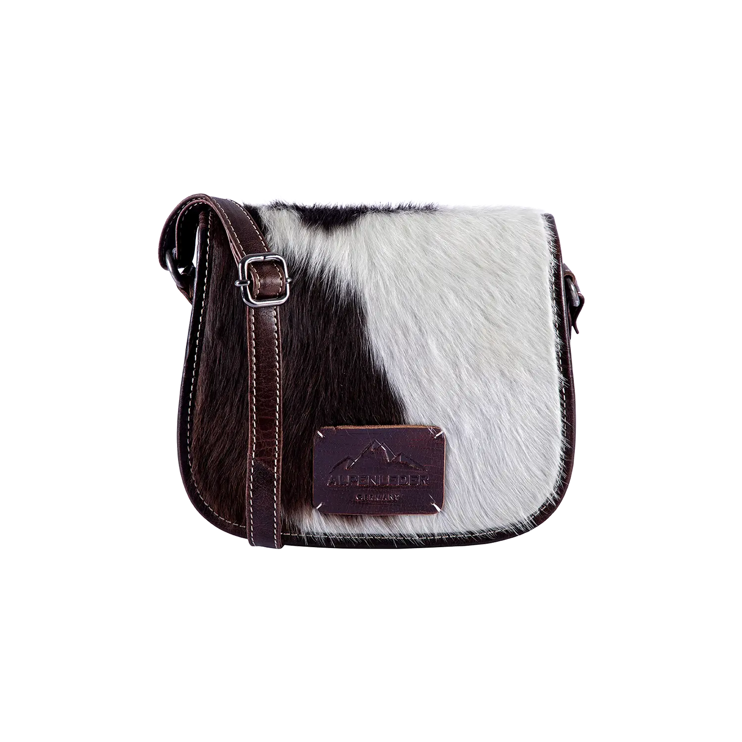 Die Umhängetasche VRONI hair on ist eine schicke Crossbody-Handtasche aus schwarz-weißem Kuhfell mit braunem Lederriemen und -klappe. Ein brauner Patch mit geprägtem Alpenleder-Logo verleiht ihr rustikalen und zugleich stilvollen Charme.