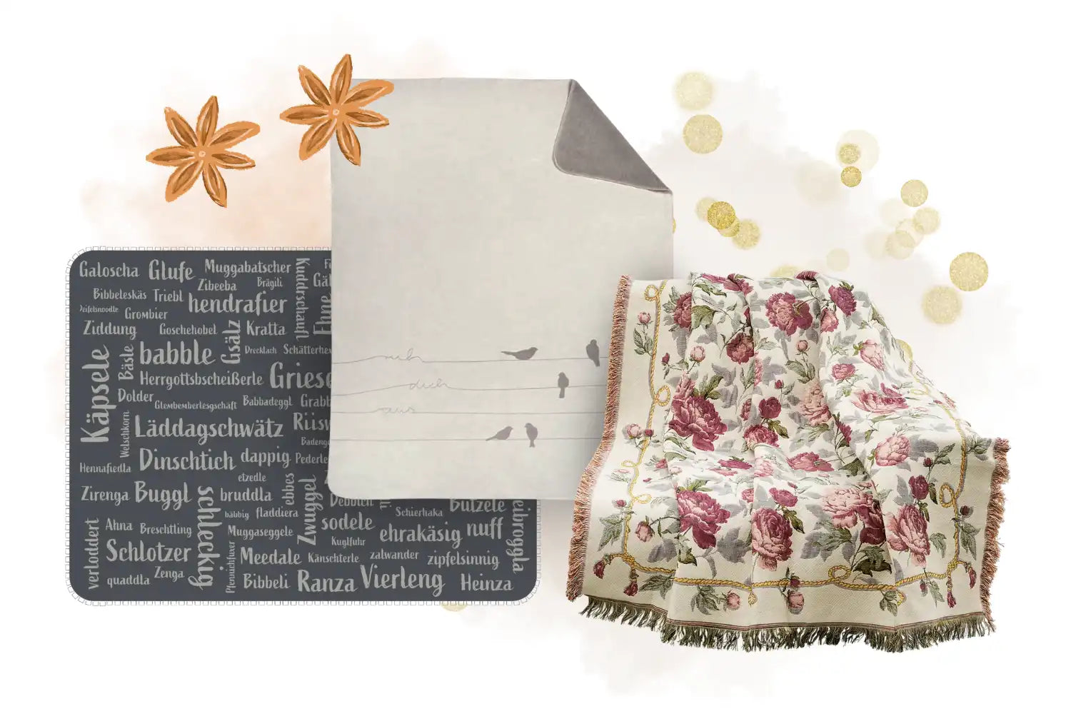 Eine geblümte Decke, ein Papier mit Vögeln, Sternanis und eine wortgefüllte Matte auf hellem Hintergrund.