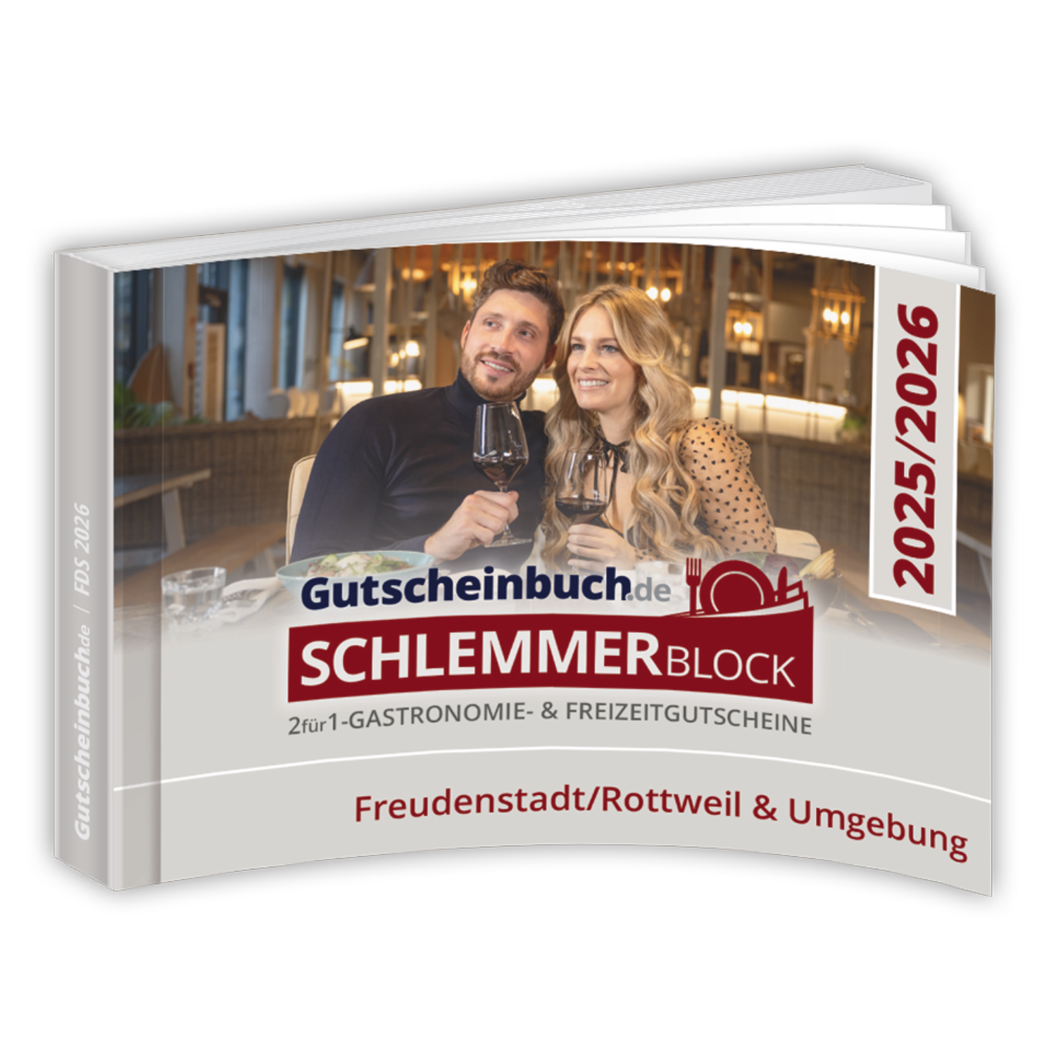 Auf dem Cover des Gutscheinbuchs Kreis Freudenstadt + Rottweil 2026 ist ein Paar beim Essen und Trinken zu sehen, das die besten Restaurants und Gutscheine in der Region präsentiert.