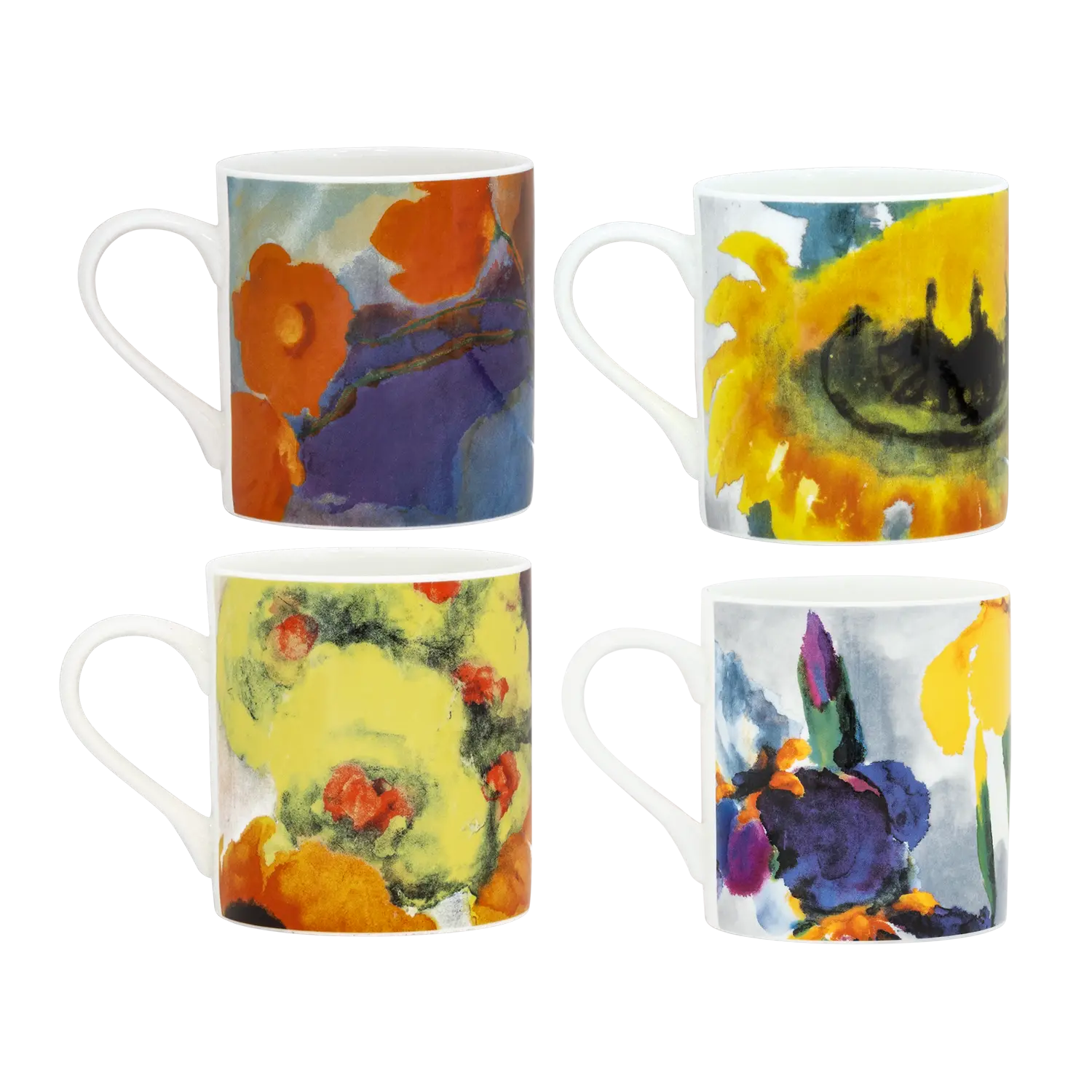 Vier Keramiktassen mit Blumenmotiven.