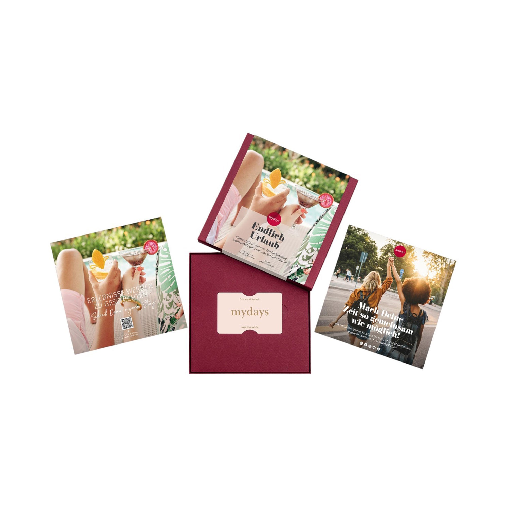 Vier quadratische Boxen mit farbenfrohen Motiven bilden ein Kreuz. Drei davon zeigen Lifestyle-Motive, eine ist rot und trägt in der Mitte den Schriftzug „mydays“. Die Erlebnis-Box Endlich Urlaub verspricht auf den ersten Blick Momente der Entspannung und Freude.