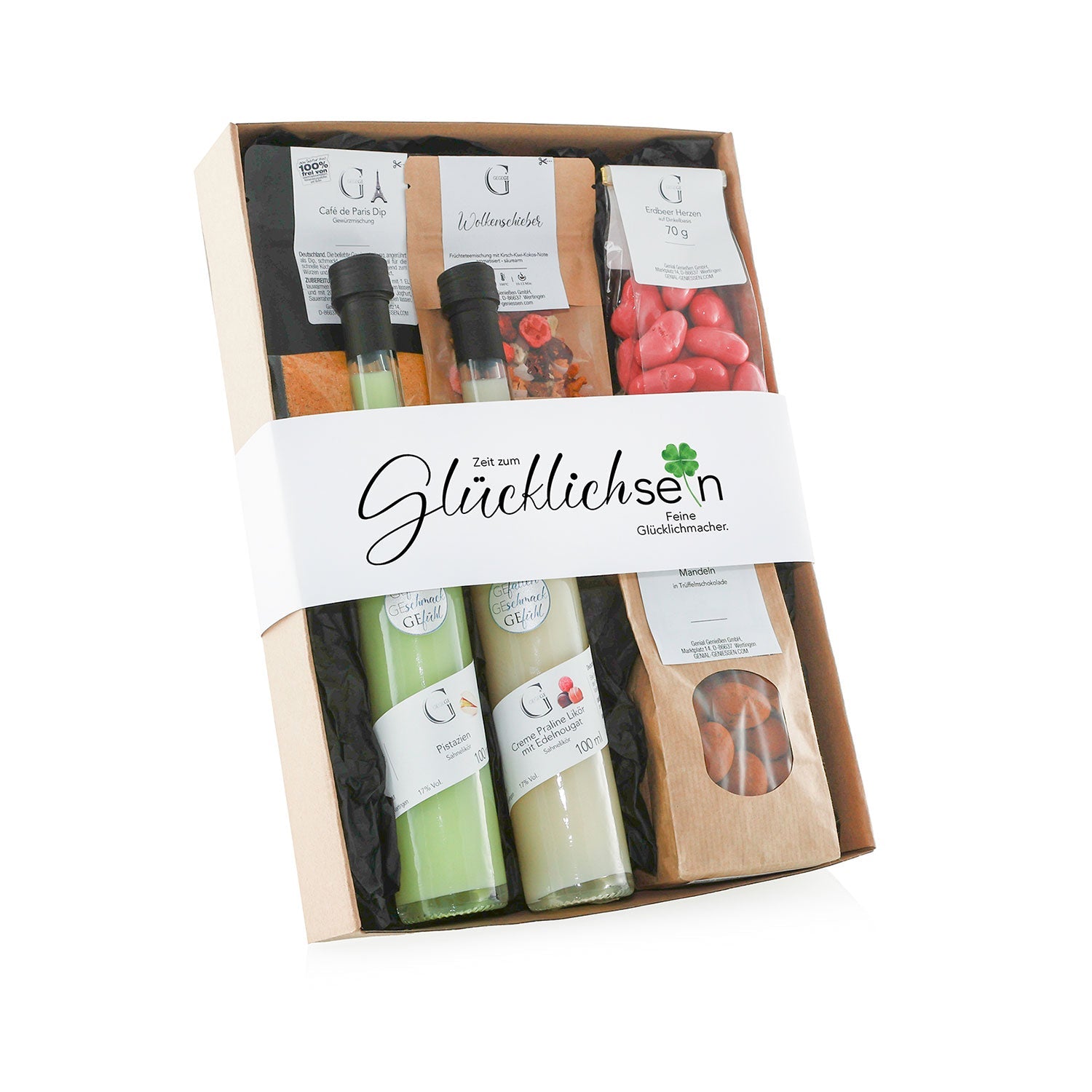 Das „Zeit zum Glücklich sein – Geschenkset“ enthält zwei Flaschen grüne Flüssigkeit mit der Aufschrift „Glück“ und „Ga“, zwei Päckchen rot umhüllte Mandeln, geröstete Mandeln, ein Päckchen Tee in einer „Glücklichsein“-Banderole und einen Pistazien Sahnelikör für zusätzlichen Genuss.
