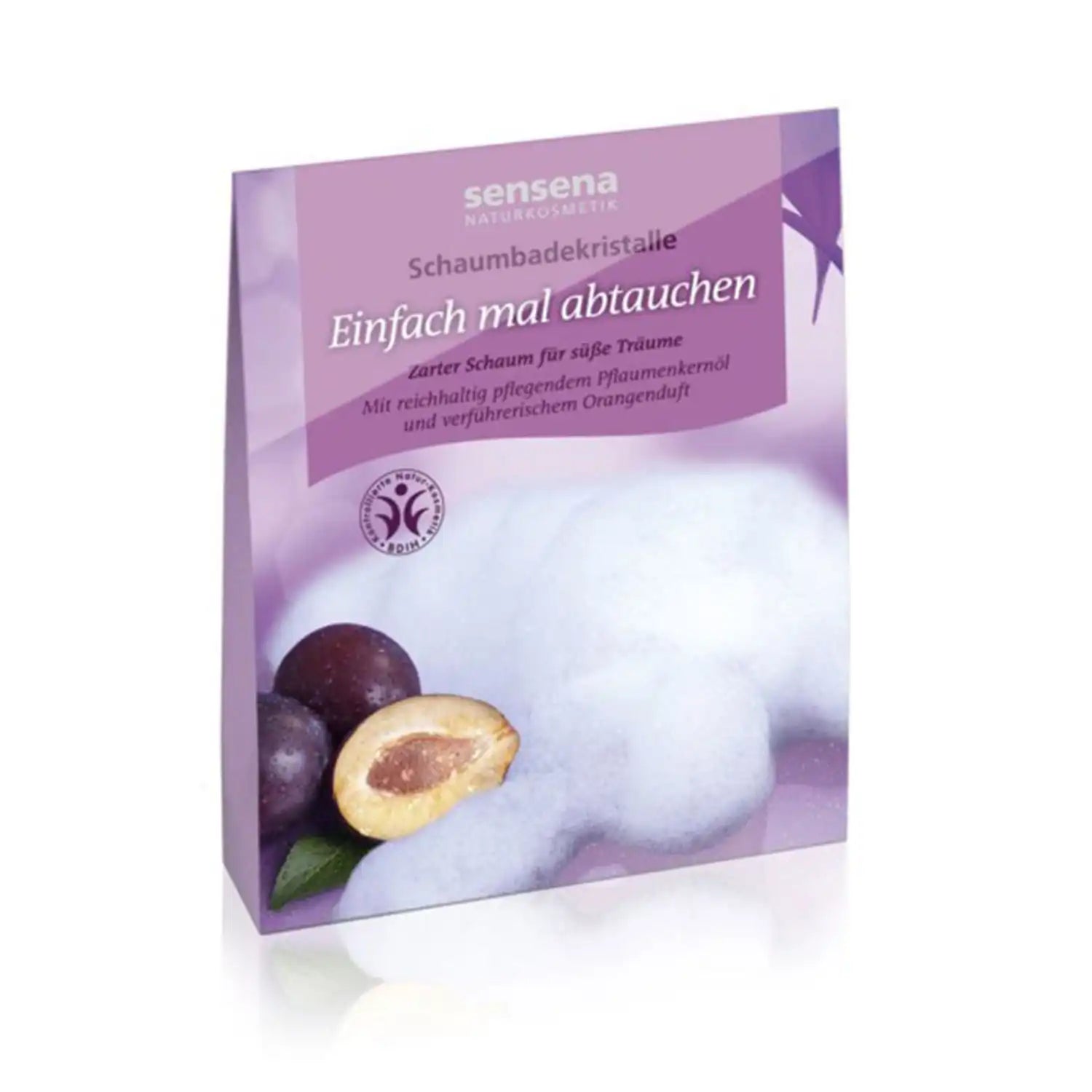 Lila Badekristall-Verpackung mit Pflaumen, Schaum und deutschem Text auf der Vorderseite.